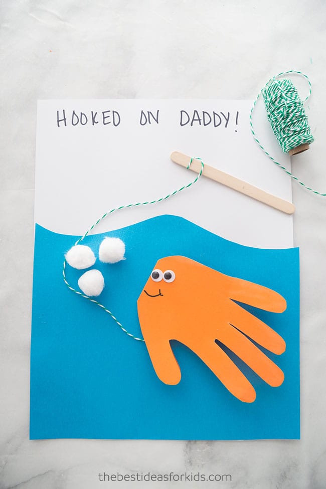 Hooked on Daddy! Homemade fish (made from a handprint) on a string father's day card as an example of father's day gifts for kids