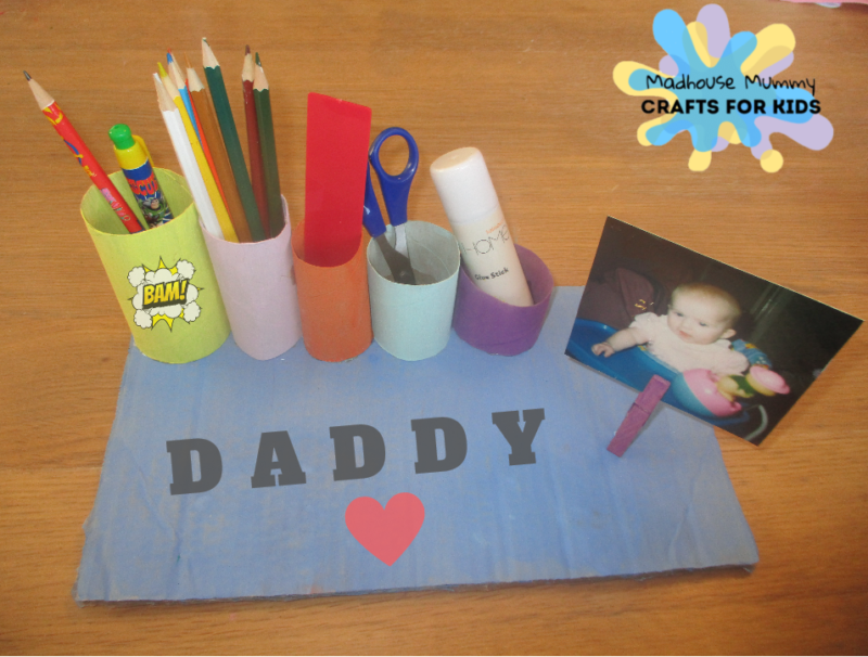 Craft-Organizer A desk organizer is made of different sized paper tubes with different colored construction paper on them as an example of father's day gifts for kids