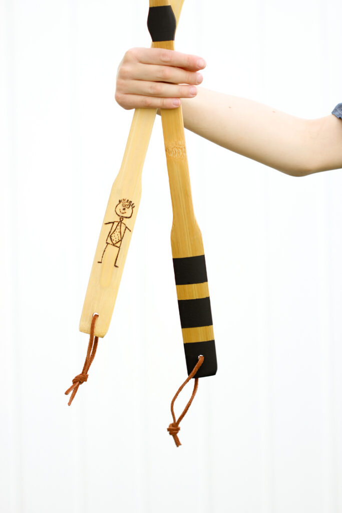 Personalized-back-scratchers Wood back scratchers are decorated with drawings and strips of tape