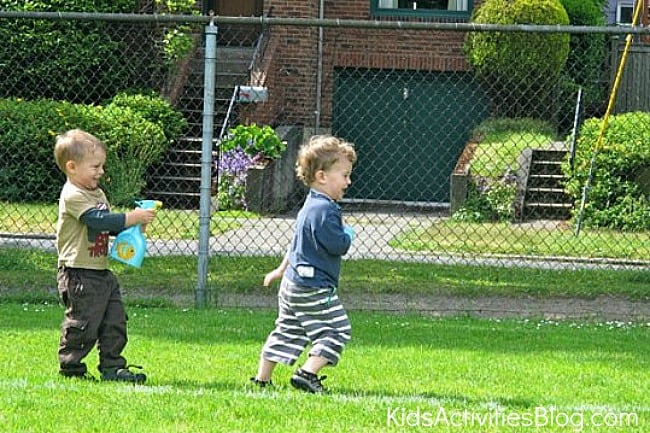Spray-Bottle-Tag boy spraying another boy with a spray bottle