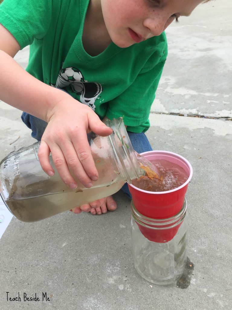 Water-Filtration child pouring water into a cup filled with dirt for water activity about filtration