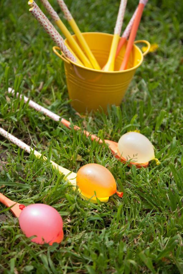 spoon-water-balloon spoons on grass with water balloons for a water activity