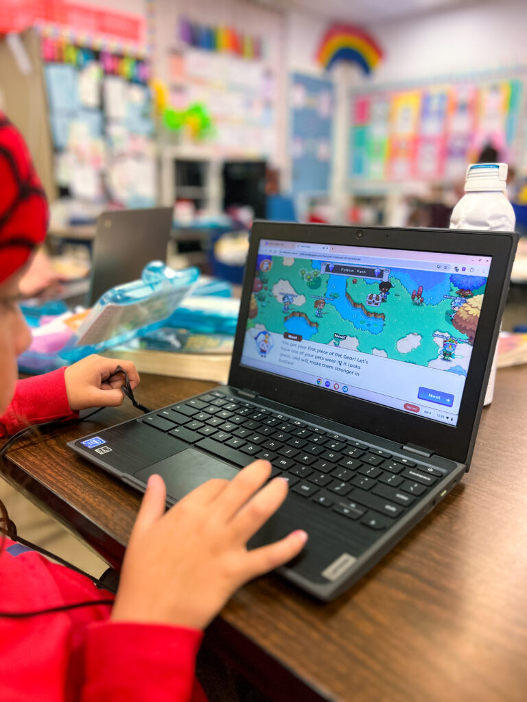 How Prodigy Math Made Practice the Most Popular Part of Our Day Image of Prodigy Math game on a student laptop with a young student's hand playing the game