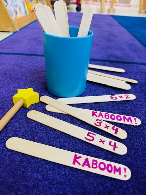Popsicle sticks with writing on them