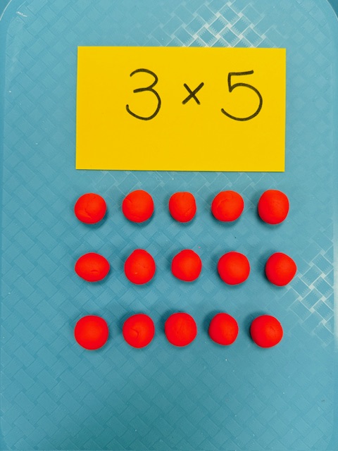 Clay pieces arranged in rows- how to teach multiplication