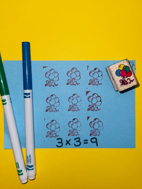 Stamp Out Multiplication! on sheet of paper- how to teach multiplication