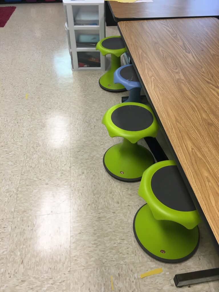 Flexible seating wobble stools in a kindergarten classroom.