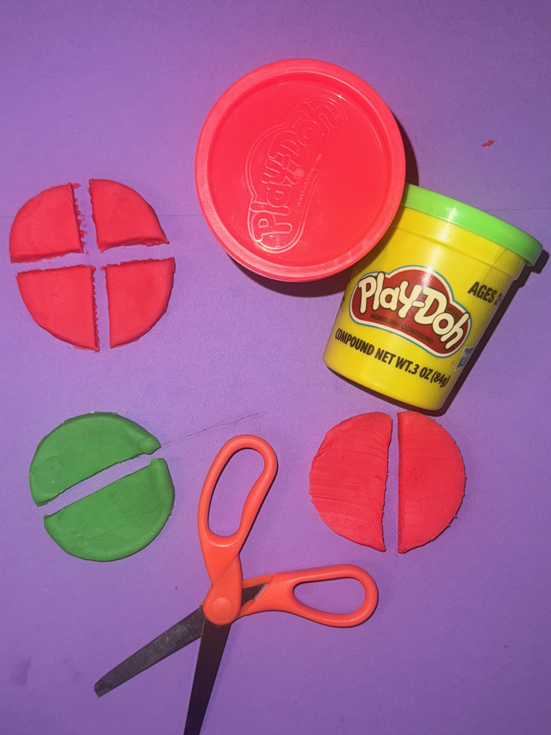 DoughyFractions2 Play-dough cut into fourths and halves to represent fractions