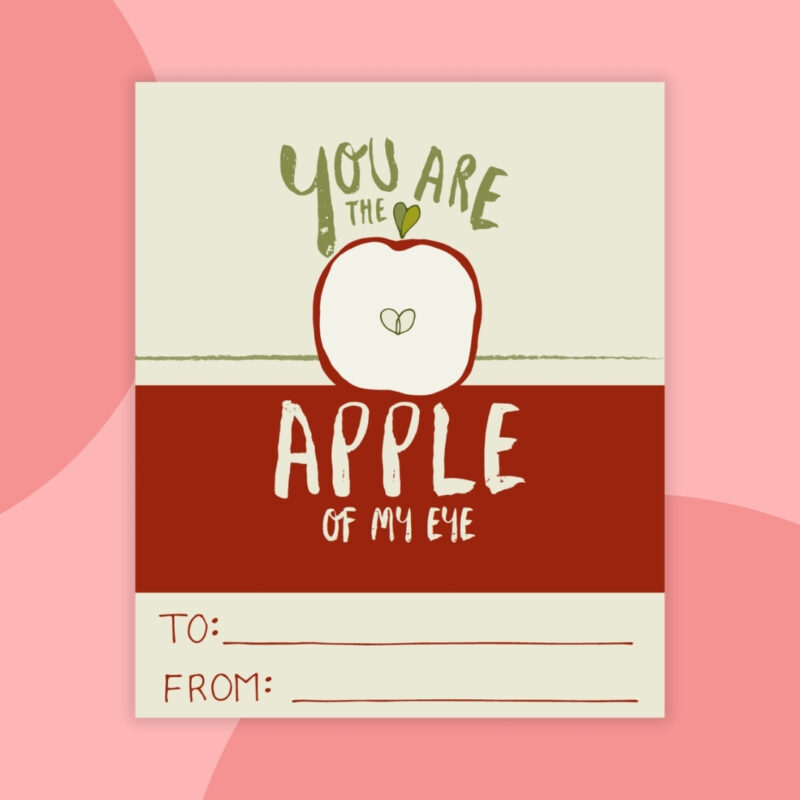 a printable valentine that says: you are the apple of my eye with a red and tan background and a red apple cut in half