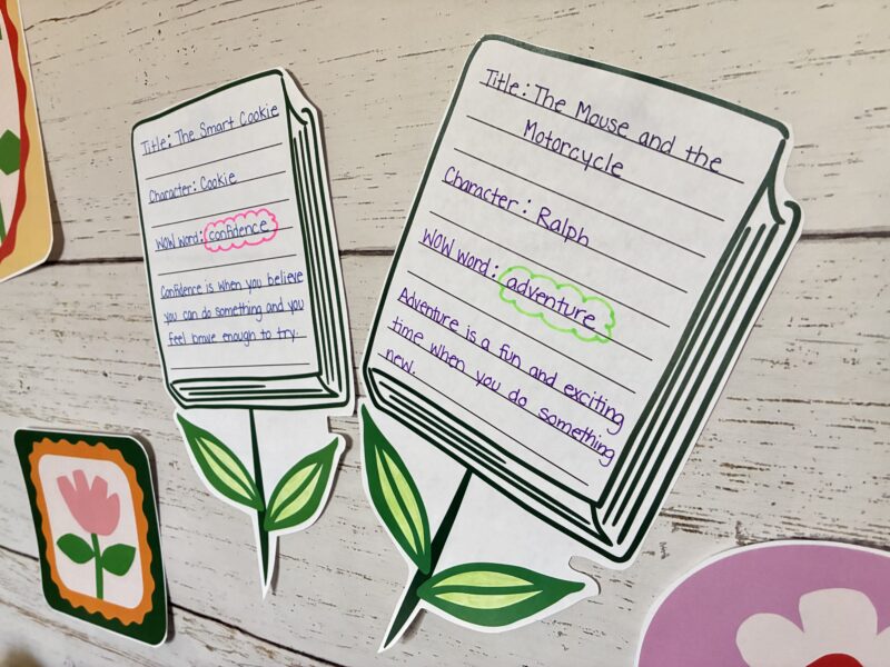 an image of two student reading flowers that are a part of the spring bulletin board kit