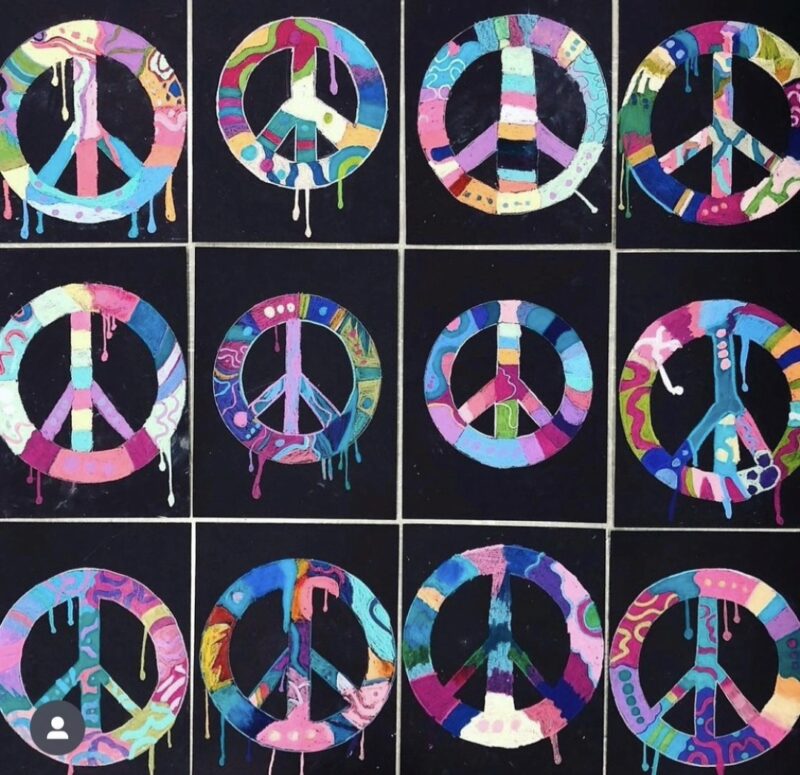 Colorful peace signs on black backgrounds