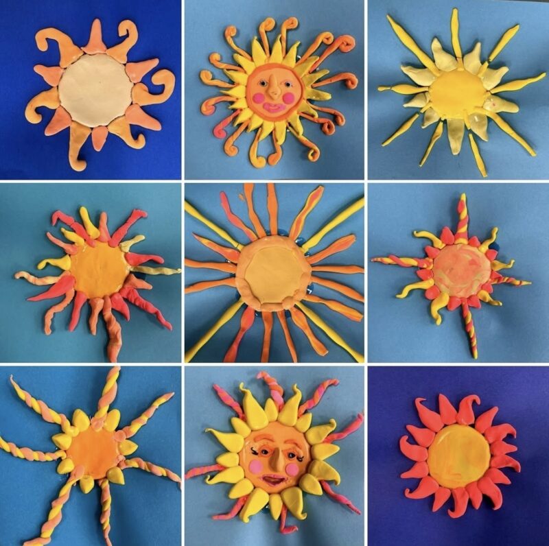 Clay suns against blue backgrounds