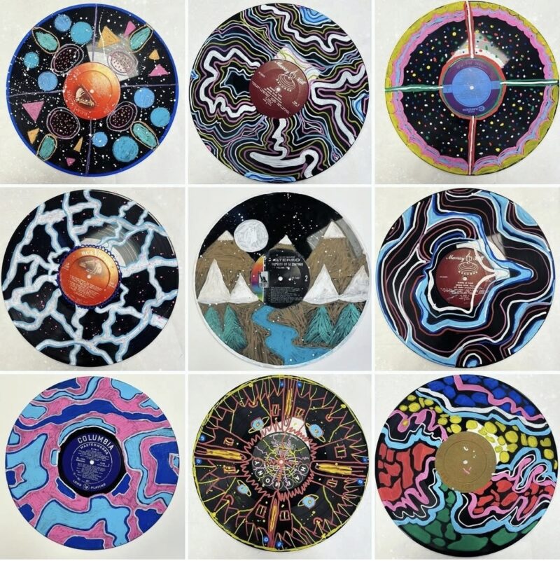Record albums painted with Posca paint markers in a variety of designs